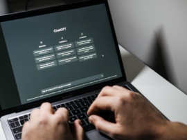 Laptop screen showing ChatGPT.