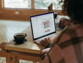 Two women working on the laptops