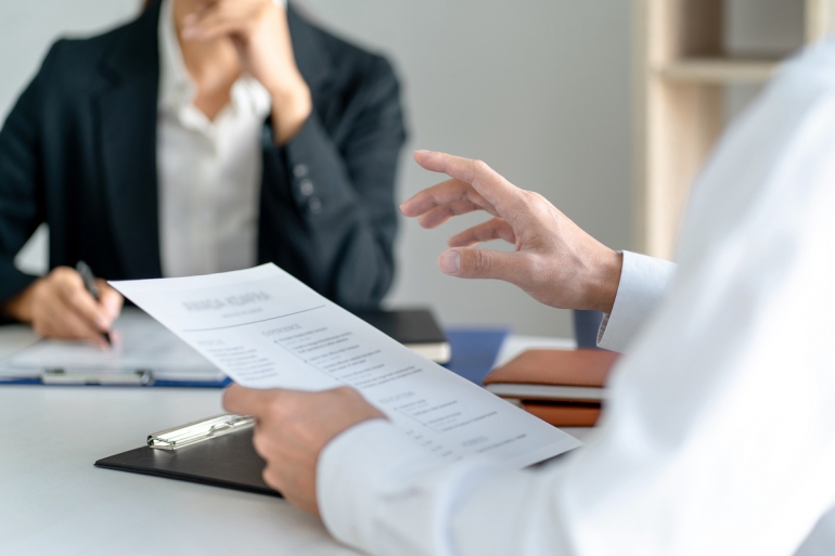 Candidate with resume at job interview with human resource, Recruitment concept.