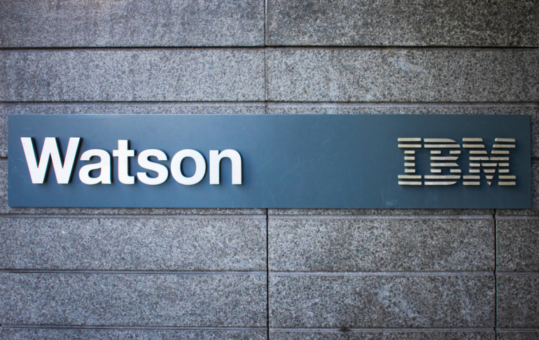 A sign with the Watson and IBM logos.